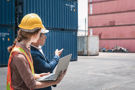 Container Shipping Logistics Engineering of Import/Export Transportation Industry, Transport Engineers Teamwork Controlling Management Containers Together at Port Ship Loading Dock. Business Teamの写真素材
