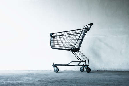 Shopping Cart in Front of Supermarket Doorway for Customers Service, Empty Shopping Trolley in Front of Convenience Grocery Store. Business Commodity Retail and Customer Market Placeの写真素材