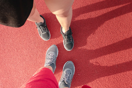 Group of Athlete Runner Exercise Jogging in Running Track, Closeup of Sport People in Workout Shoe in Outdoor Running Track.  Healthy Lifestyle and Fitness Exercisingの写真素材