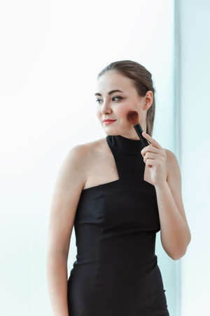 Beauty Face Skin Care and Makeup Cosmetic, Closeup Portrait of Pretty Woman in Sexy Fashion With Happy Smile and Powder Brush. Facail Cosmetology Make-Up Brush Applying for Beauty Perfect Healthy Skinの写真素材