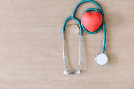 Top View of Doctor Workspace With Stethoscope and Personal Equipment on Table Desk, Above View of Doctor Working Space at Clinic Hospital. Health Medical Occupation and Business Healthcare Conceptの写真素材