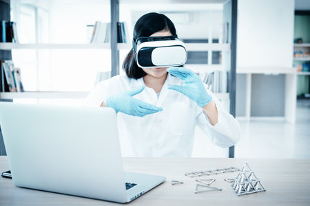 Laboratory Research Scientist and Science Innovation Concept, Female Scientists Analyzing Chemical Structure via Virtual Reality Glasses Technology. Professional Chemist Working Experiment in Labの写真素材