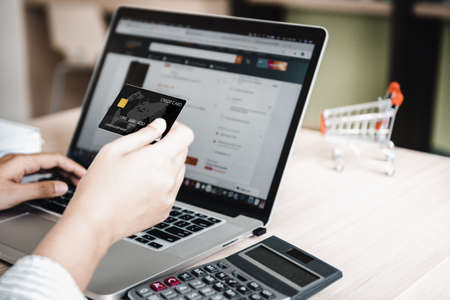 Business E-commerce and Online Shopping Concept, Shopaholic Paying Money Via Credit Card on Shop Online. Customer Ordering Purchase Online Market Website With Credit Card Payment. Electronic Bankingの写真素材