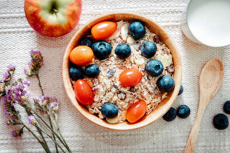 Homemade Granola Muesli Oatmeal for Breakfast Food, Granola With Fresh Fruit and Milk for Breakfast. Natural Baked Muesli and Mixing Fruits for Morning Meals. Diet Granola Homemade Meal for Healthyの写真素材
