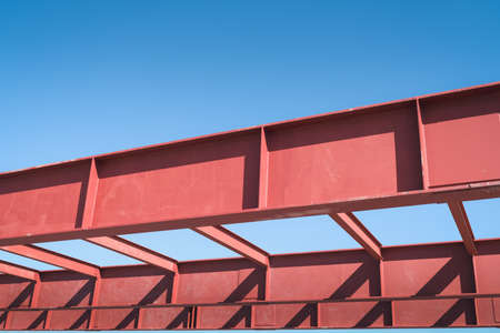 Steel Structure Beam Girder of Building at Construction Site, Metal I-Beam Erection Detail and Coat Painting Rust Resistant Under Construction. Steelwork Structural Engineering Design Assembly Workの写真素材