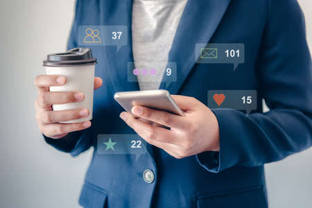 Technology Smartphone and Digital Application Network Concept, Business Woman Using Smart Phone While Chatting on Communication Social App. Multimedia Applications of Data Mobile Phone Connectionの写真素材