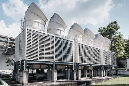 Cooling Pipes System of Manufacturing Factory, Cooled Chiller Machines Tower and Pipeline Equipment of Manufacture Industry. HVAC Cooling Systems and Distribution Steel Pipping. Air Conditioningの写真素材
