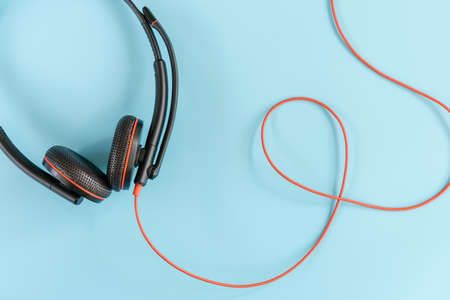 Customer Call Center Headphones of Operator Service on Isolated Blue Background, Headset Accessory Device of Operation Customers Services Support. Communication Headphone Equipment of Digital Media.の写真素材