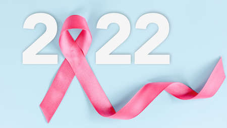 Pink Ribbon of Breast Cancer Awareness on Year 2022. Wellness Campaign Banner of Cancer Awareness and Health Care, World Cancer Day Concept. Healthcare and Medicine Year 2022 Conceptsの写真素材