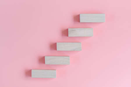 Step Strategic Target Plan and Goal Vision Concepts, Wooden Stair Steps on Isolated Pink Background. Management Trend Marketing for Success Project. Direction Steps to Business Success and Developmentの写真素材