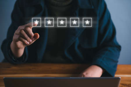 Feedback Customer Satisfaction Service Concept. Finger Hand is Choosing Rate Five Star for Customers Service. Product Questionnaire for Satisfaction Survey. Quality Evaluation Rating From Customerの写真素材