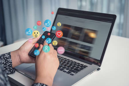 Social Media and Technology Internet Communication Connection Concept. Business Woman's Hands is Using Social Media Via Smartphone With Notification Icon. Technology Digital Media Mobile Phone Networkの写真素材
