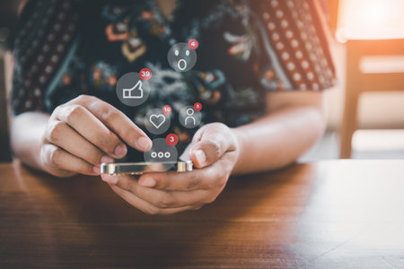 Social Media and Technology Internet Communication Connection Concept. Business Woman's Hands is Using Social Media Via Smartphone With Notification Icon. Technology Digital Media Mobile Phone Networkの写真素材