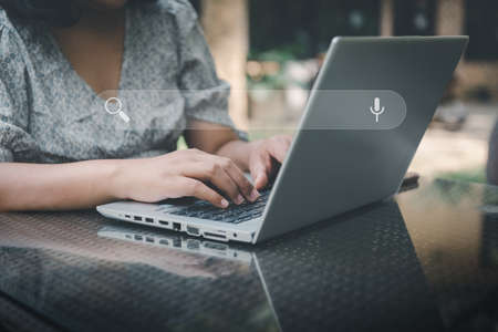 Search Engine Optimization (SEO) Banner for Business Marketing. Businesswoman Searching Keywords on Address Bar for Website Online Network. Technology Internet Browsing and Search Engine System.の写真素材