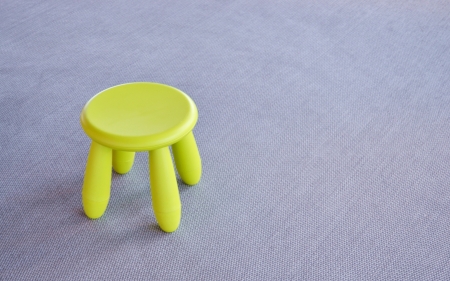 green small chair on the gray floorの写真素材
