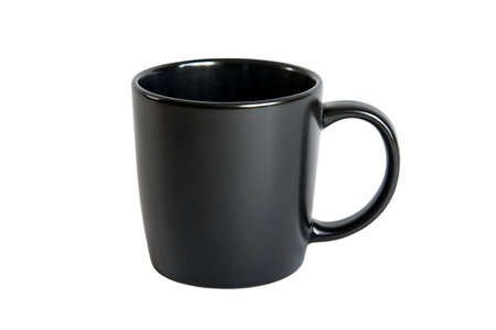 A simple black ceramic mug, ideal for coffee or tea.  Perfect for a minimalist aesthetic.の写真素材