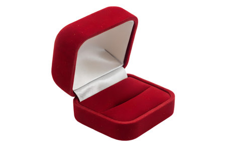 A red velvet ring box is open, showing its empty interior.  The box is small and square.