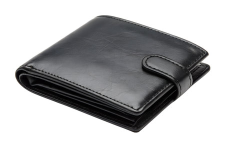 A black leather wallet isolated on a black background. The wallet is closed and appears to be made...