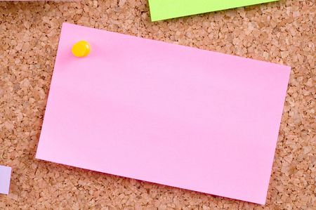 colorful papers on cork board