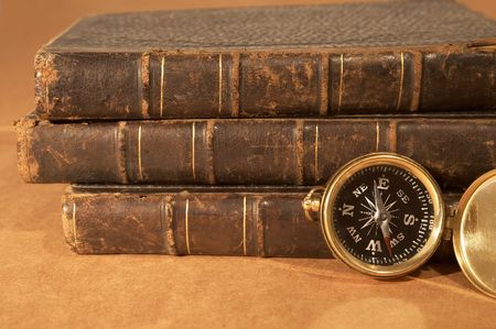 antique books with old compass close up, shallow dofの写真素材