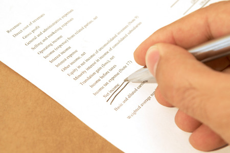 businessman working on income statement