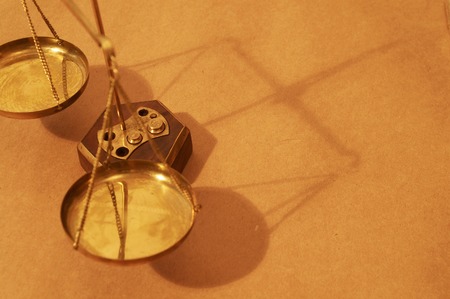 shadow of the balance of scales close up, space for messagesの写真素材