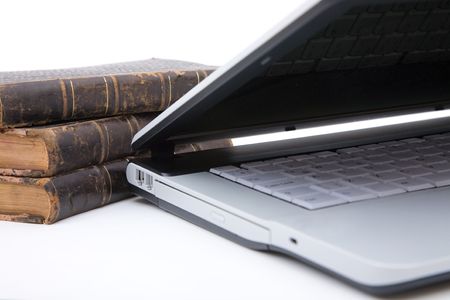 old legal books with modern laptop on white backgroundの写真素材