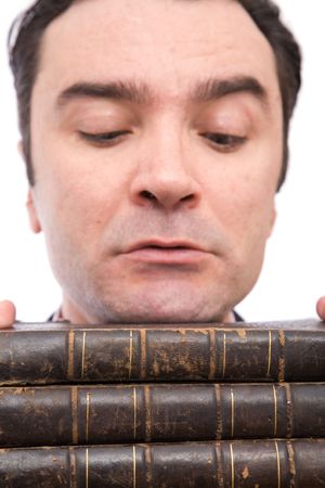 senior businessman with old books on white