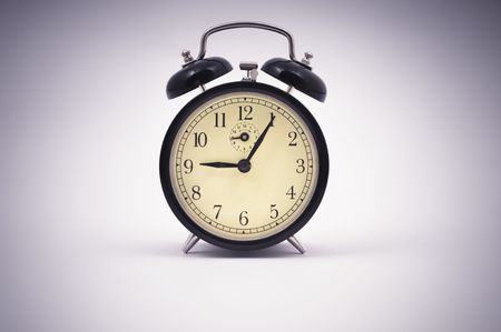 Old style alarm clock close up with vignette