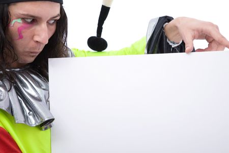 funny looking joker with blank board  and making facesの写真素材