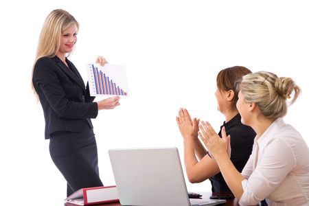 business presentation with charts and young businesswomenの写真素材