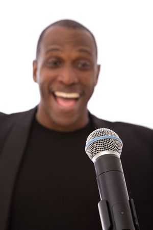 Handsome african american singer with microphone on white
の写真素材