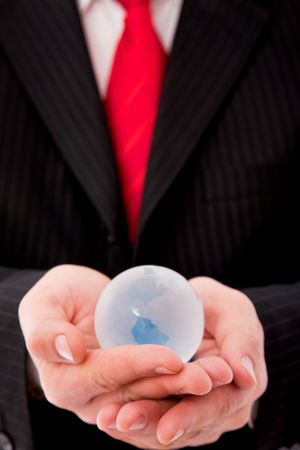 businessman close up with a glass globe, shallow dof の写真素材