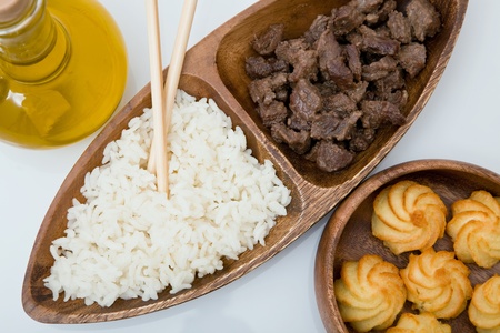 japanese food with rice, potato and chopsticksの写真素材