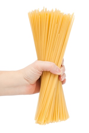 Hand holding uncooked spaghetti bolognaise  の写真素材