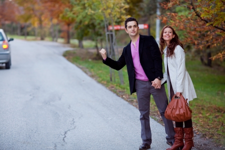 young couple travelling via hitchhikeの写真素材