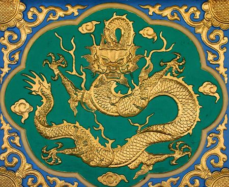 Chinese golden dragon at the wall.の写真素材
