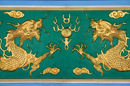 Chinese golden dragon at the wall.の写真素材