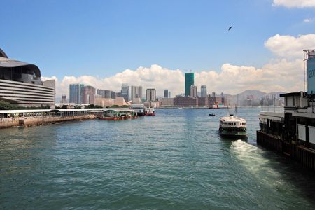 A ferry leaving Wan Chai ferry pier near Hong Kong Convention And Exhibition Centre.