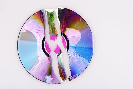 Cracked compact disc in pieces.の写真素材