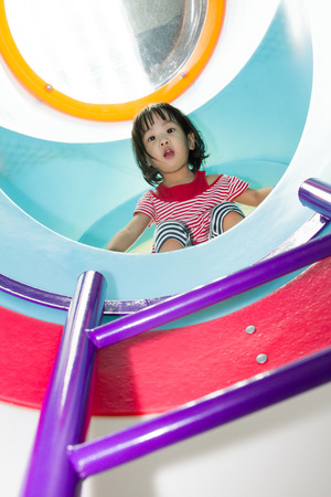 Asian Chinese Girl having funtime at Playground.の写真素材
