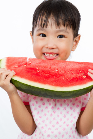 Asian Little Chinese Girl Eating Watermelon isolated on White Backgroundの写真素材