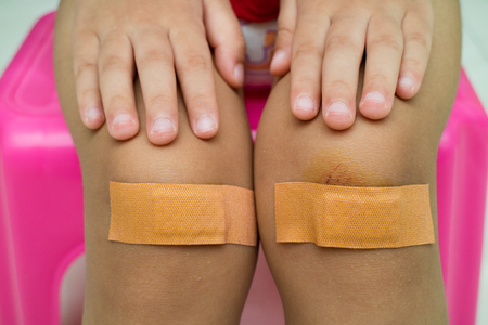 Child with plaster on Knee Close Upの写真素材