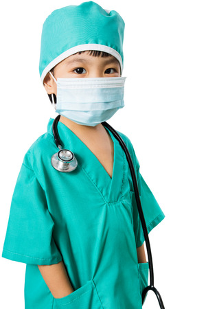 Asian Little Chinese Girl Playing a Doctor with Mask and Stethoscope  in isolated White Backgroundの写真素材