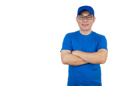 Asian Chinese man wearing blue shirt with crossed arm in isoalted white background.