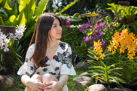 Asian beautiful young woman in the garden on a sunny dayの写真素材