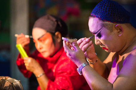 A group of Chinese Opera member prepares at backstage for a performance in Tanjung Sepat, Selangor, Malaysia on Wednesday, Jul. 19, 2017. 

The Opera Group is from Thailand Shengngoy Troupe, they perform the opera in Chinese Teochew dialect.のeditorial素材