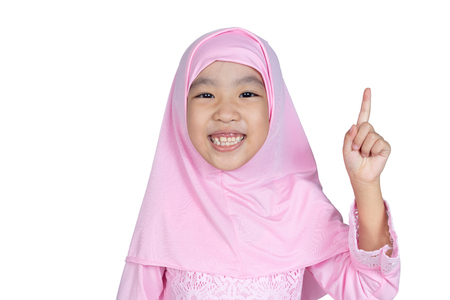 Asian Little Chinese Girl wearing traditional Malay costume in isolated white backgroundの写真素材
