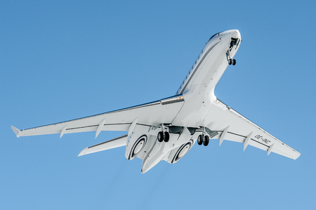 Departure in a Blue sky for this Global 5000, leaving Engadin Airportのeditorial素材