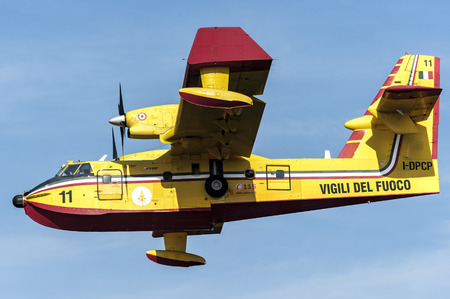 10 September 2016 Bombardier 415 Superscooper CL-415 Canadair take water from the Viverone Lake near Turin, Italy. This amphibious airplane is used by Protezione Civile for aerial firefighting.のeditorial素材